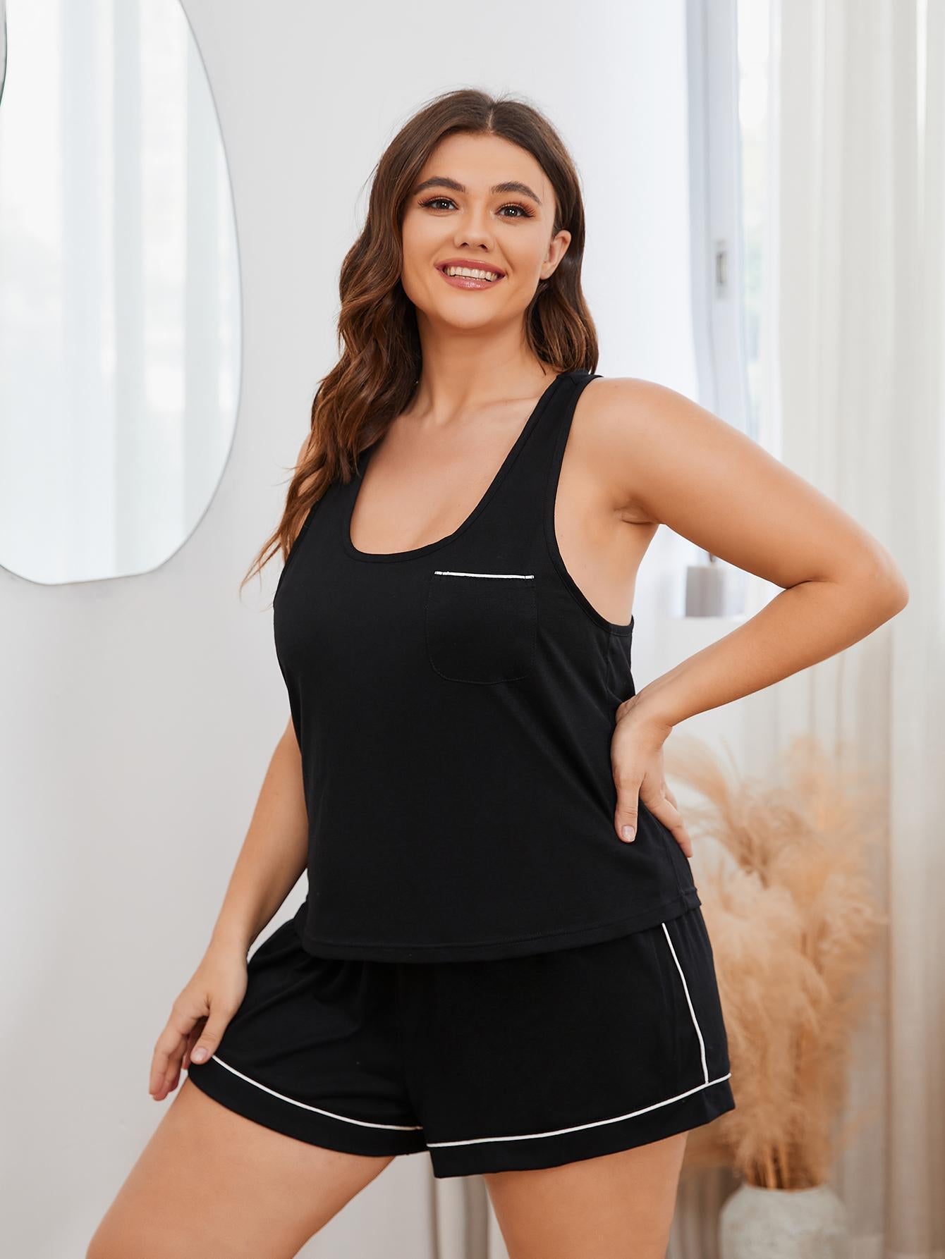 Black racerback lounge top with contrast trim and pocket, paired with matching shorts.