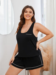 Black racerback lounge top with contrast trim and pocket, paired with matching shorts.