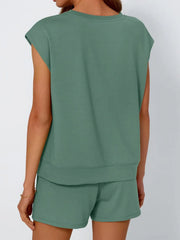 Relaxed cap-sleeve loungewear set in green, featuring a crew neck top and matching shorts.