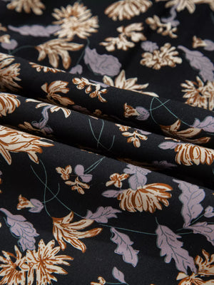 Floral babydoll dress fabric with deep v neckline and bubble sleeves in dark floral print.