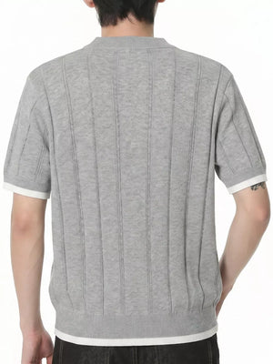 Grey knit t-shirt with contrast white accents on sleeves and hem, featuring vertical ribbed texture.