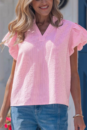 Pink and white striped textured short sleeve blouse with flutter sleeves and V-neck.