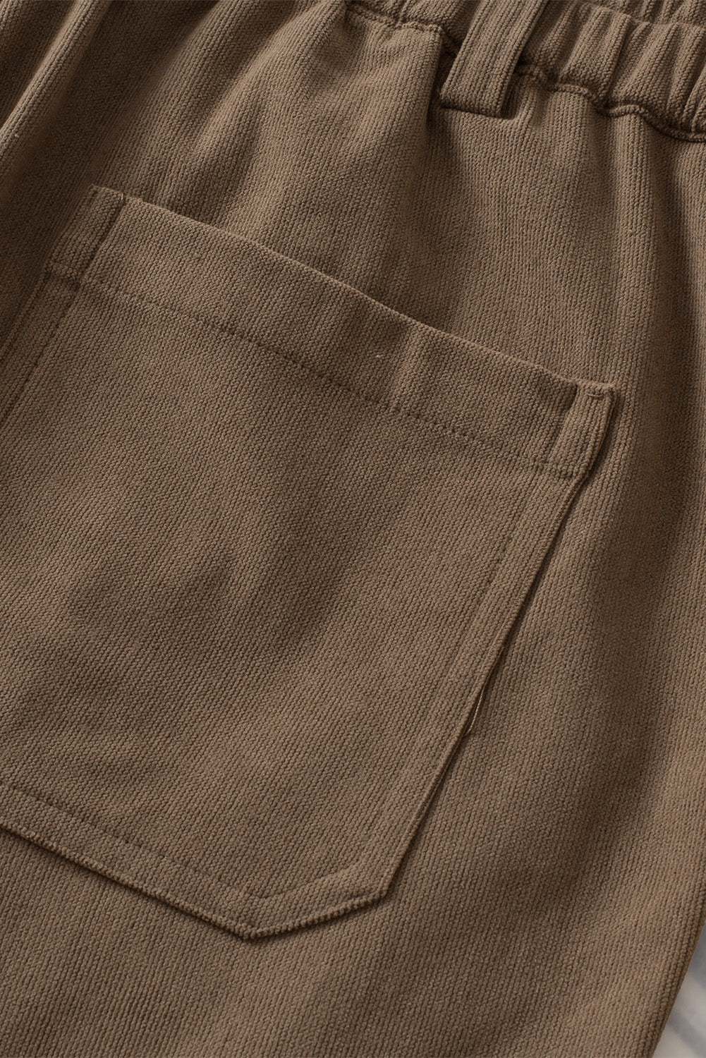 Caramel seamed front wide leg trousers with a back pocket detail.