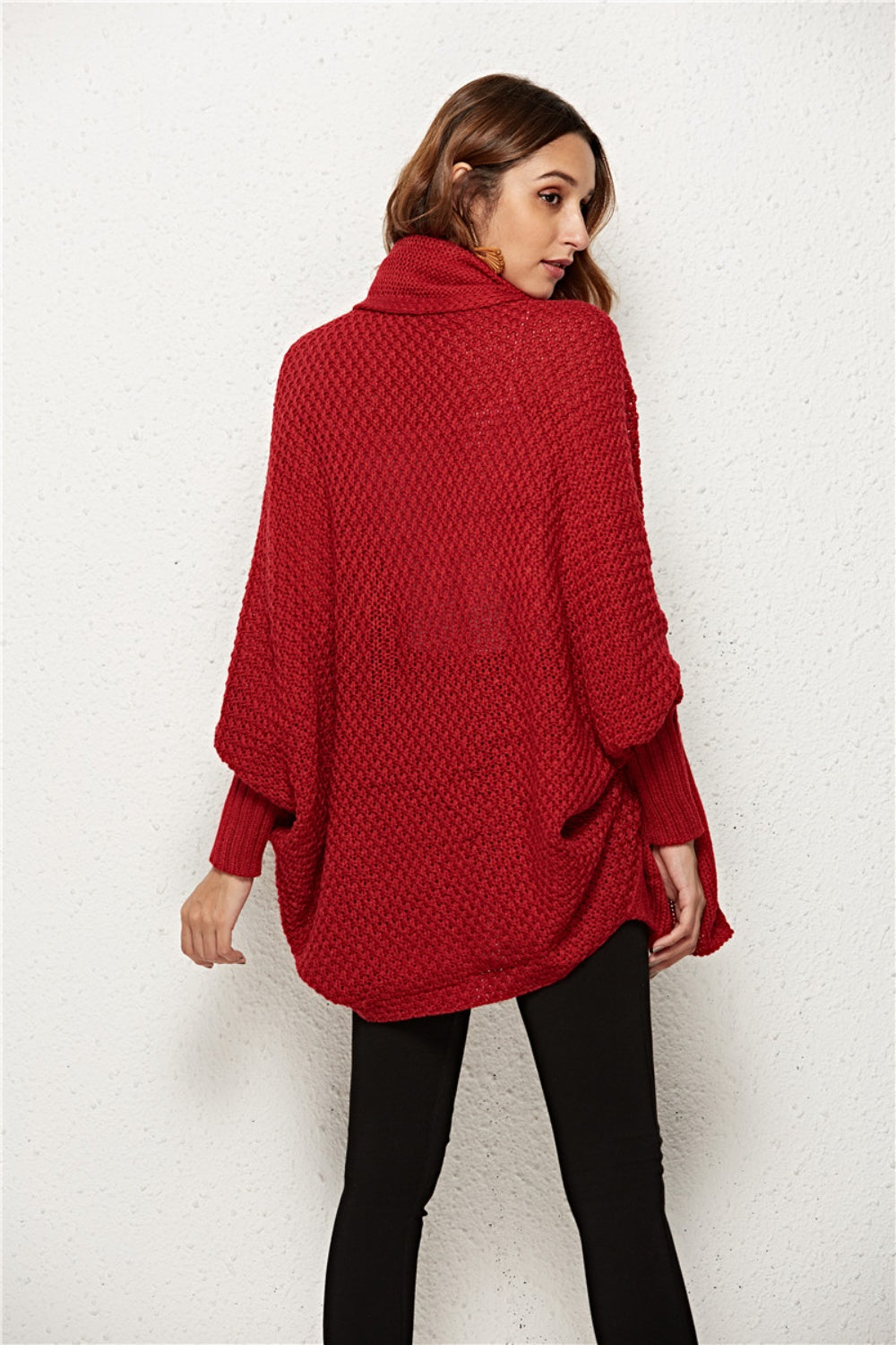 Textured cocoon knit cardigan in deep red with batwing sleeves and turtleneck.