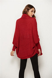 Textured cocoon knit cardigan in deep red with batwing sleeves and turtleneck.
