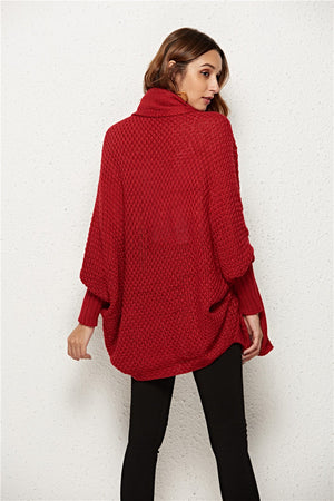 Textured cocoon knit cardigan in deep red with batwing sleeves and turtleneck.