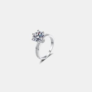 Sterling silver ring with pavé band and large moissanite solitaire diamond.