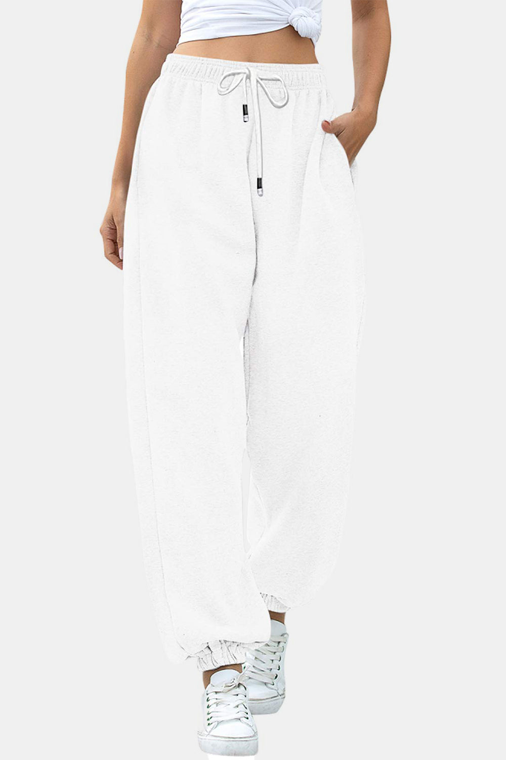 White relaxed-fit cuffed sweatpants with drawstring waist and pockets.
