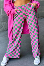 Checkerboard palazzo trousers in fuchsia pink and green with a wide leg and elastic waist.