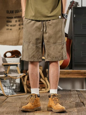 Men's taupe drawstring shorts, relaxed fit, casual style with detailed stitching.