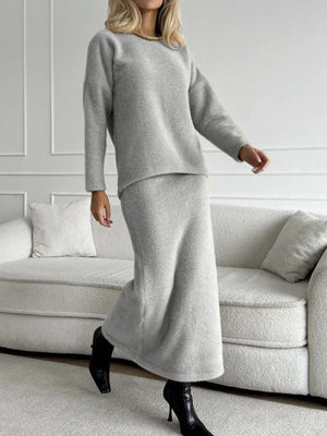 Gray textured knit co-ord set with relaxed fit sweater and midi skirt.