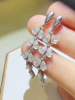 Cascading moissanite pear drop earrings in silver with a bright, chic sparkle.