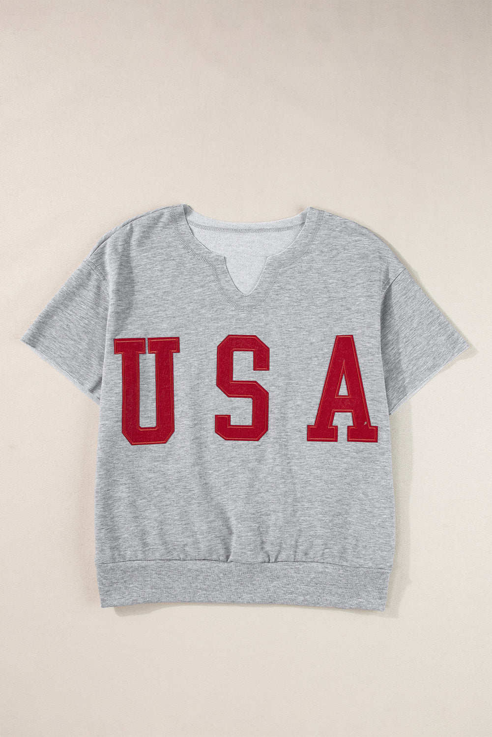 Gray sweatshirt with red USA appliqué and notch neckline