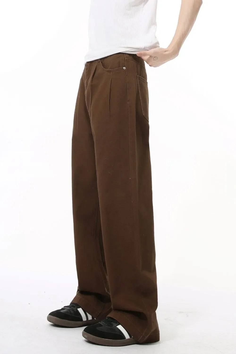 Chocolate wide-leg denim trousers with front pleats and a relaxed fit.