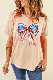 Eggshell t-shirt with a watercolor American flag bow graphic.