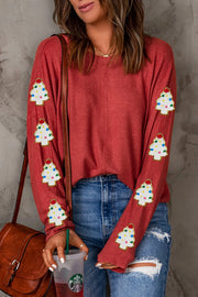 Scarlet long sleeve sweater with embellished Christmas tree patches on sleeves.