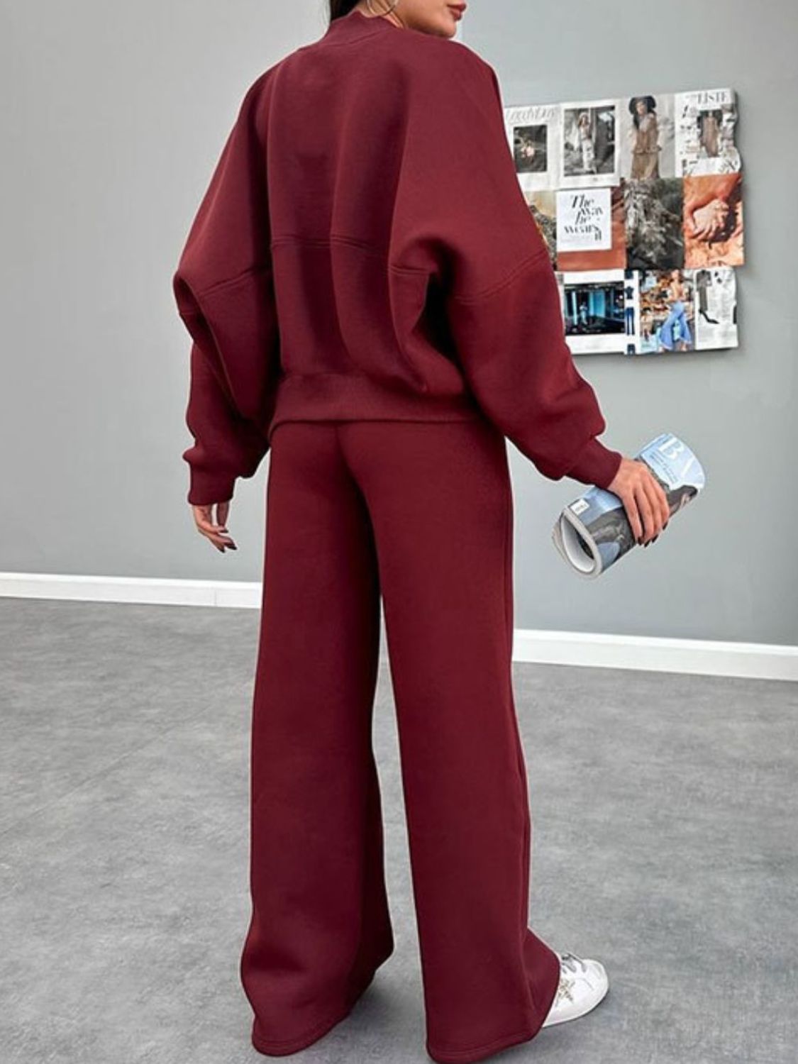 Burgundy zip-up sweatshirt and wide-leg pants set with crew neck and relaxed fit.