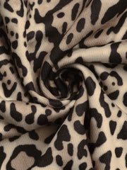 Leopard print jacket fabric detail in tan and black.