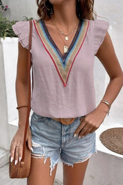 Dusty pink flutter sleeve blouse with colorful embroidered V-neck trim