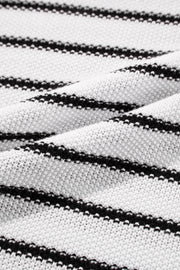 Black and cream striped acrylic knit sweater with contrast trim detail.