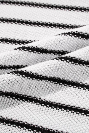 Black and cream striped acrylic knit sweater with contrast trim detail.