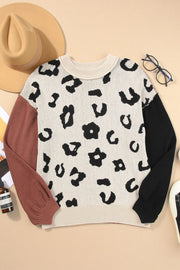 Colorblock leopard print knit sweater with crew neck and long sleeves in acrylic and cotton blend.