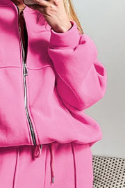 Fuchsia pink zip-up bomber jacket with drawstring joggers.