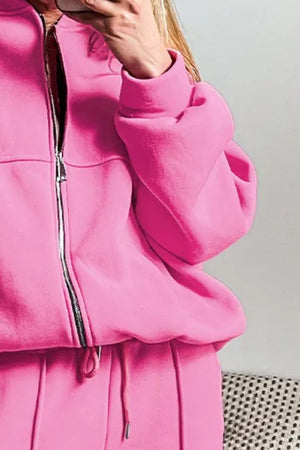 Fuchsia pink zip-up bomber jacket with drawstring joggers.