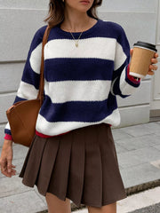 Casual ribbed knit sweater with navy and white stripes, crew neck, and long sleeves.