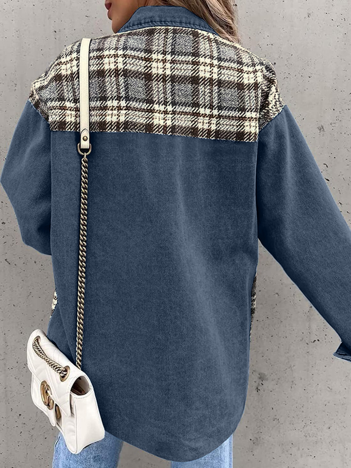 Denim jacket with plaid paneling on shoulders, long sleeves, buttoned front, in dusty blue.