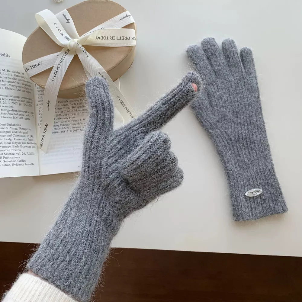 Gray ribbed knit touchscreen gloves with a pink detail on the index finger.