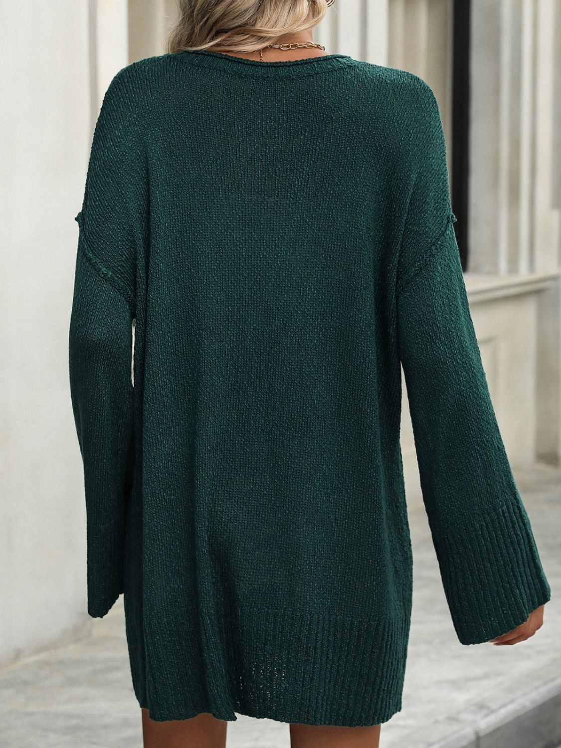 Oversized ribbed knit tunic sweater in Black Forest green with long sleeves and a relaxed fit.