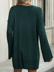 Oversized ribbed knit tunic sweater in Black Forest green with long sleeves and a relaxed fit.