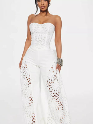 White lace cutout tube top and wide-leg pants set with intricate eyelet details on the legs.