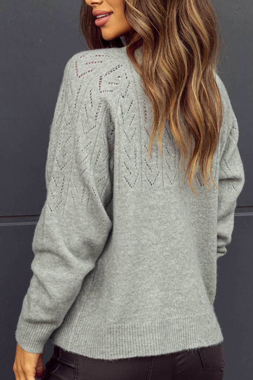Gray lace-effect knit cardigan with diamond pattern detail on shoulders and sleeves.