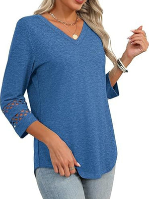 Blue 3/4 sleeve t-shirt with V-neck and cutout detail on sleeves.
