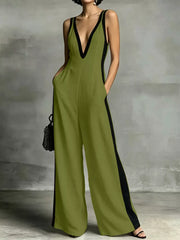 Olive wide-leg jumpsuit with deep V-neck and contrast trim, sleeveless, with pockets.