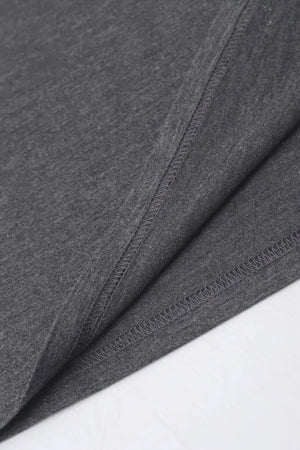 Dark gray t-shirt detail showing hem and side seam stitching