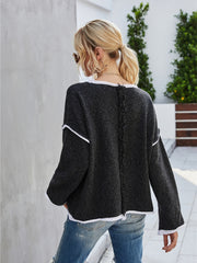 Dark gray knit pullover sweater with white trim and frayed back seam detail.