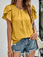 Textured puff sleeve mustard dot blouse with pleated front and round neckline.