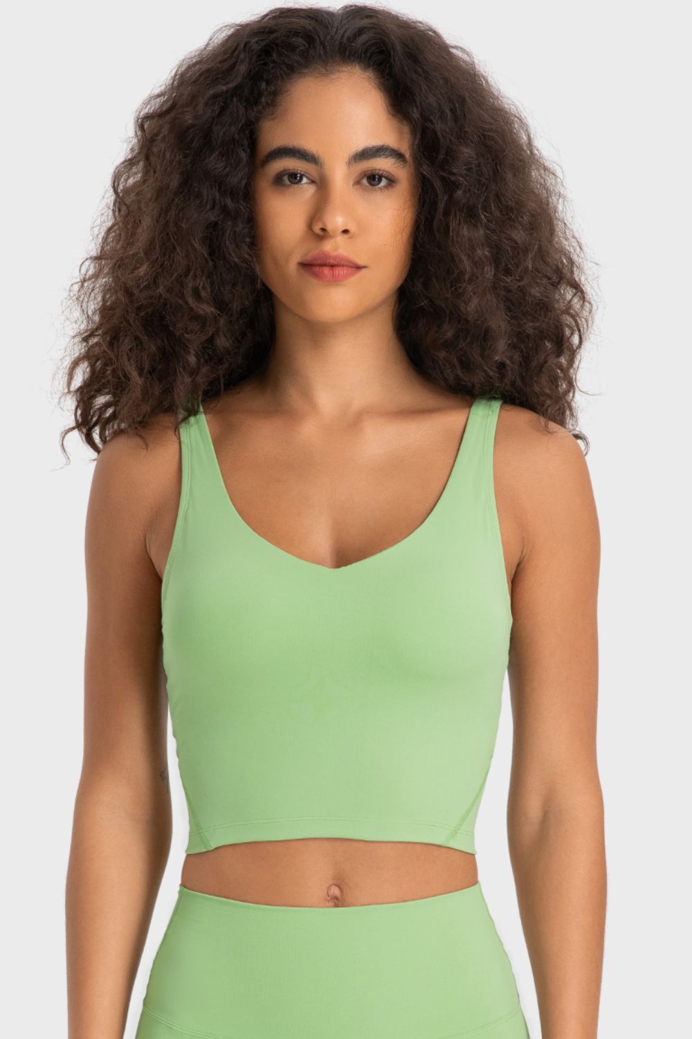 Light green scoop neck crop top with a fitted silhouette.