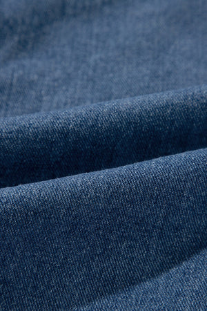 Medium wash denim blazer fabric detail
