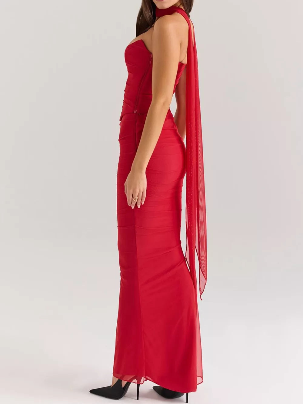 Red sweetheart tube top and flowy maxi skirt set with sheer cape detail.