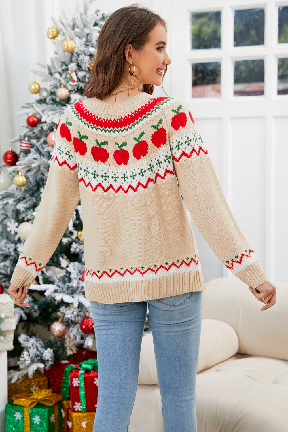 Tan acrylic sweater with festive apple motif Fair Isle pattern and crew neck.
