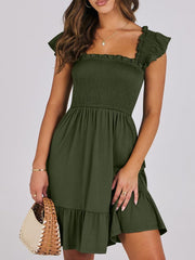 Smocked ruffle hem mini dress in army green with square neckline and flutter sleeves.