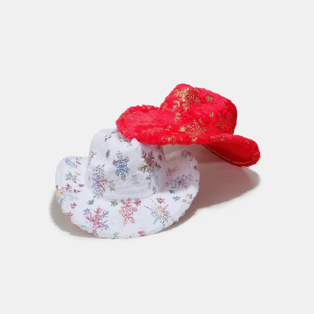 Crimson faux fur cowboy hat with gold snowflake pattern and white cowboy hat with colorful snowflake pattern.