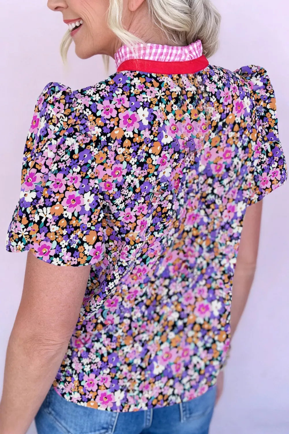 Floral drape v-neck shirt with puff sleeves and pink gingham collar trim.