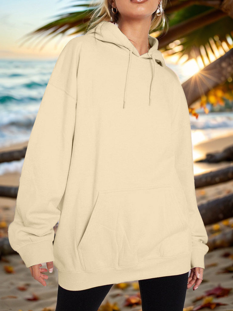 Oversized light yellow hoodie with pouch pocket and drawstring hood.