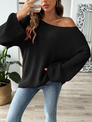 Black off-the-shoulder ribbed knit pullover sweater with bell sleeves.