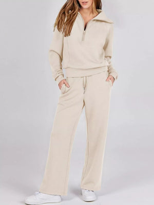 Beige half zip loungewear set with a collared neckline and drawstring waist pants.